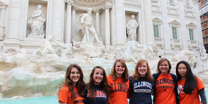 Study abroad students by a fountain